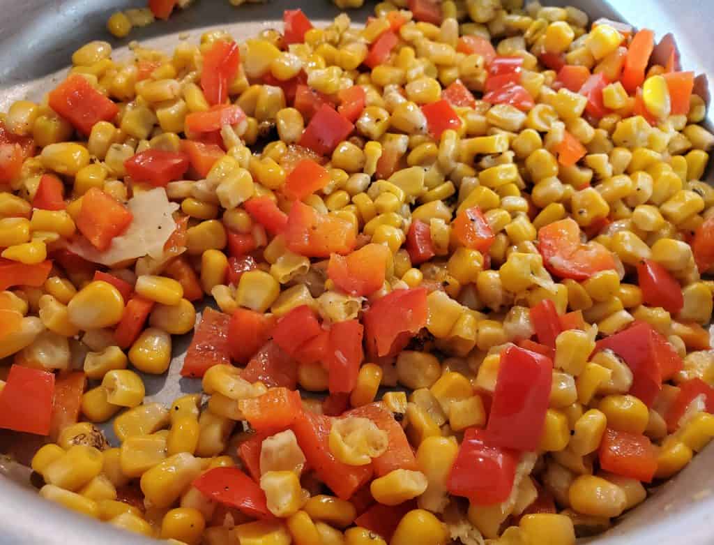 Fire-roasted corn and red peppers finished in the skillet