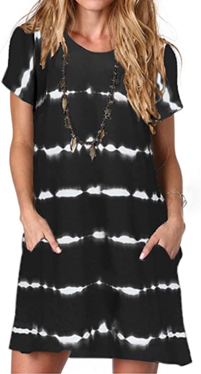 A dress style tunic top for moms that has pockets. It is shown in black with white lines that are spaced apart and have a tie-dye look.