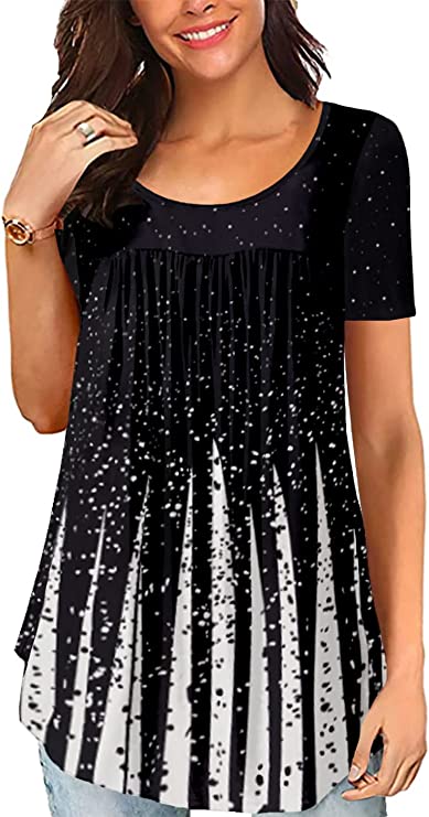 With a rounded neck and pleated bottom, this tunic top for moms is flowing and has a variety of patterns. It is shown in black with white dots and accents.