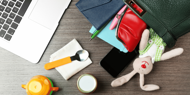 Mompreneur cover photo of a laptop and purse with business items, toys and a sippy cup spilling out of it