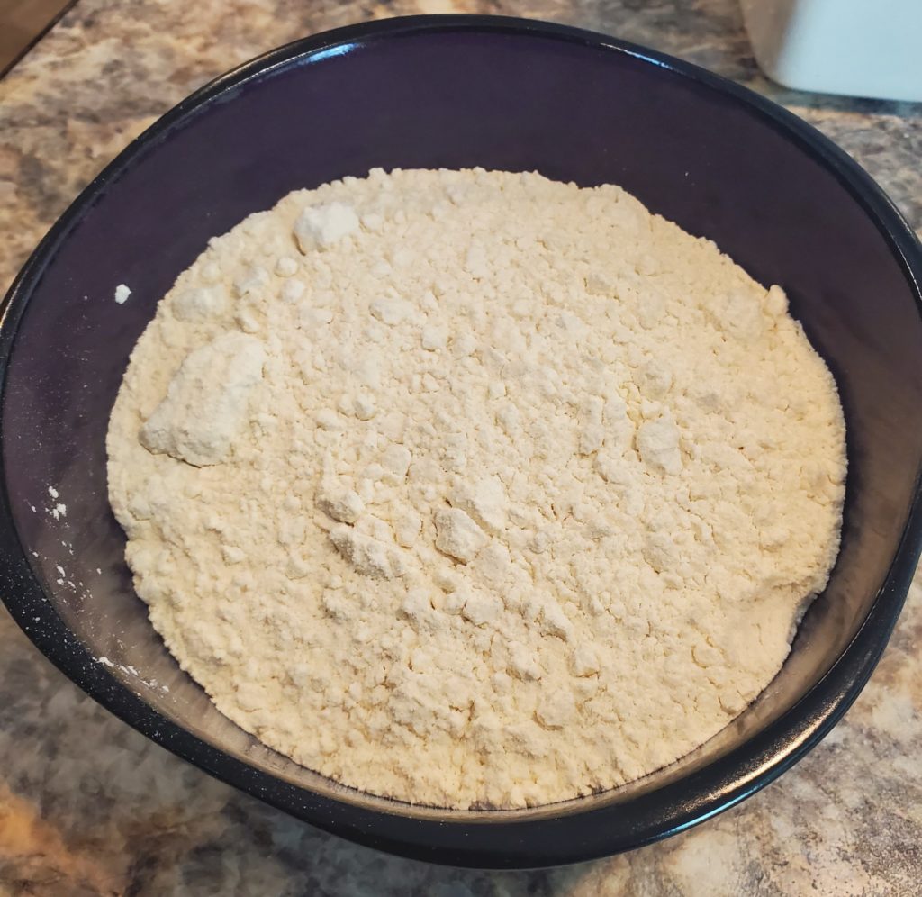 A bowl of flour to heat-treat for the edible chocolate chip cookie dough recipe