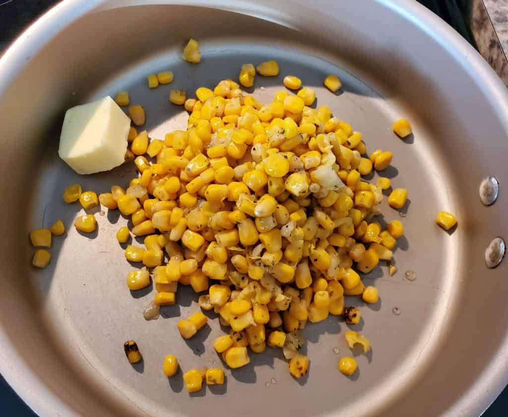 Fire-roasted corn and 1 tablespoon of butter in a medium skillet over medium-high heat