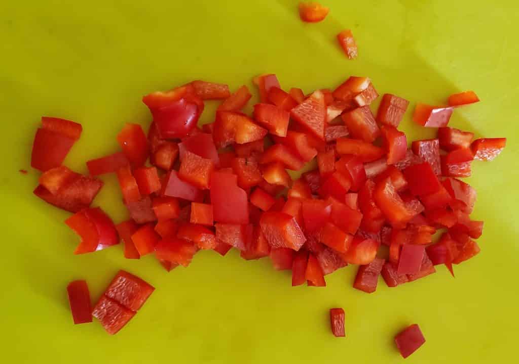 Diced red bell pepper for the fire-roasted corn and red pepper recipe