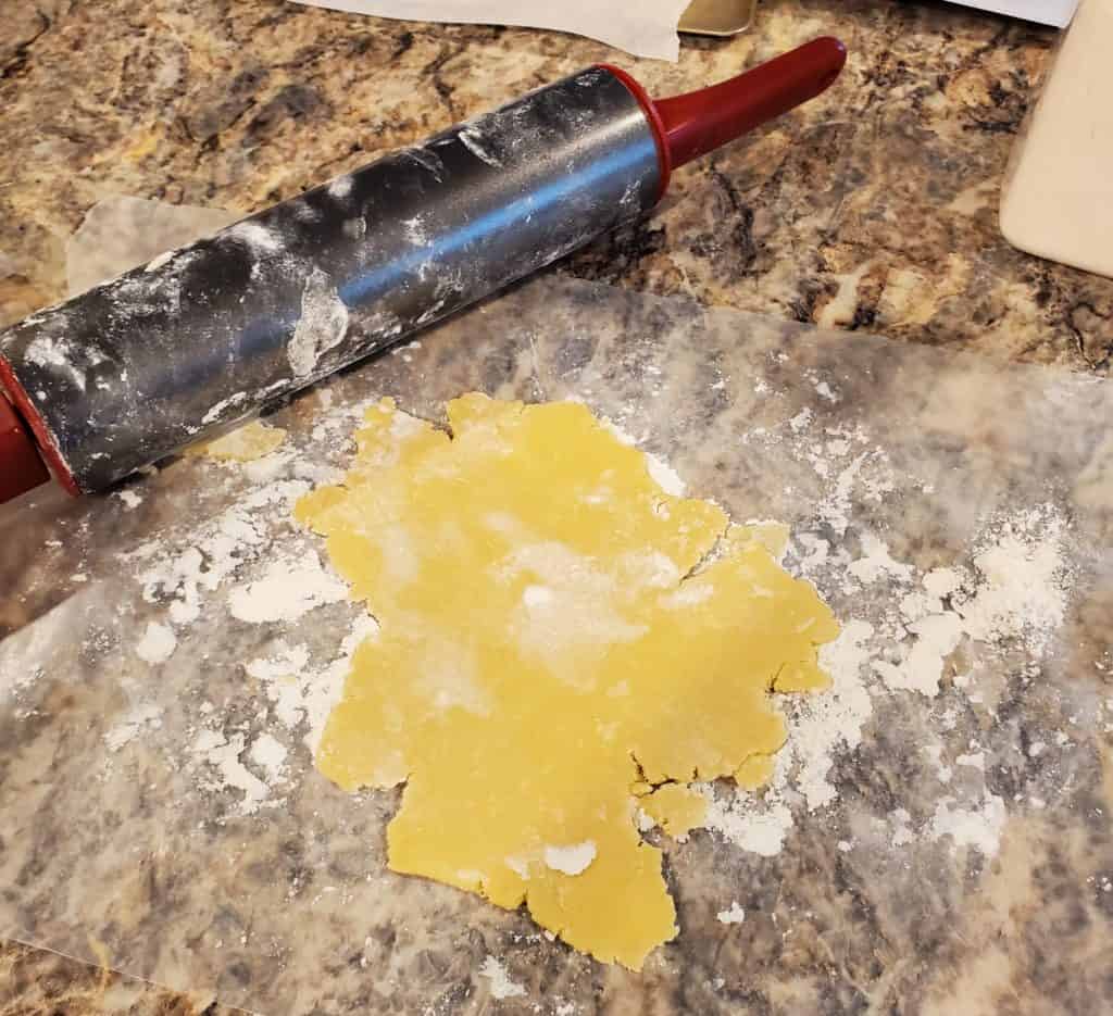The sugar cookie dough rolled out and ready to be cut