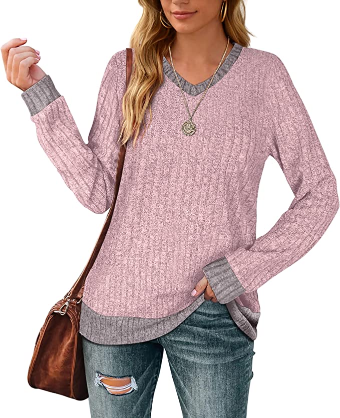 A v-neck tunic top for moms that has a different color of cuff, neck and hem from the body of the top. Shown in light pink with gray trim.