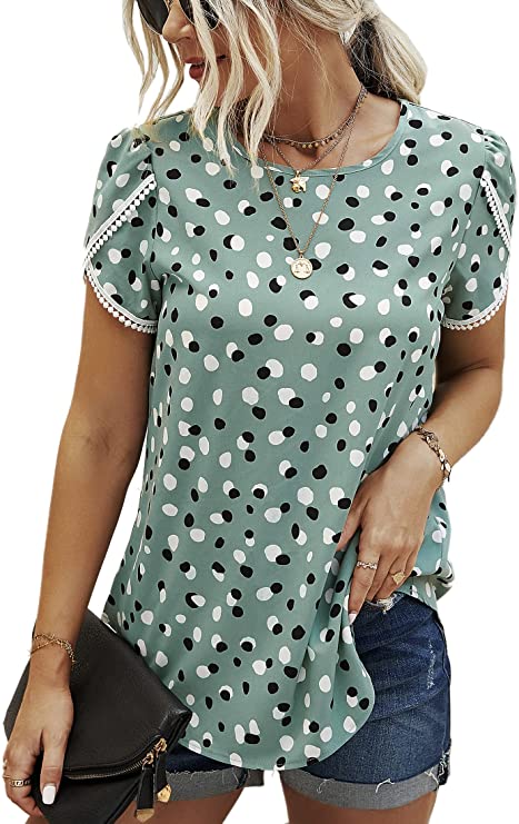 This tunic top for moms has crochet trim details on the sleeves. It is shown in a sage green with black and white polka dots.