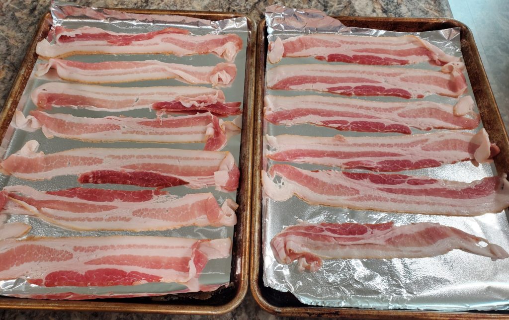 Bacon placed onto the prepared baking sheets and ready to go into the oven