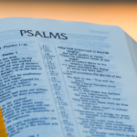 A photo of the Bible opened to the beginning of the book of Psalms