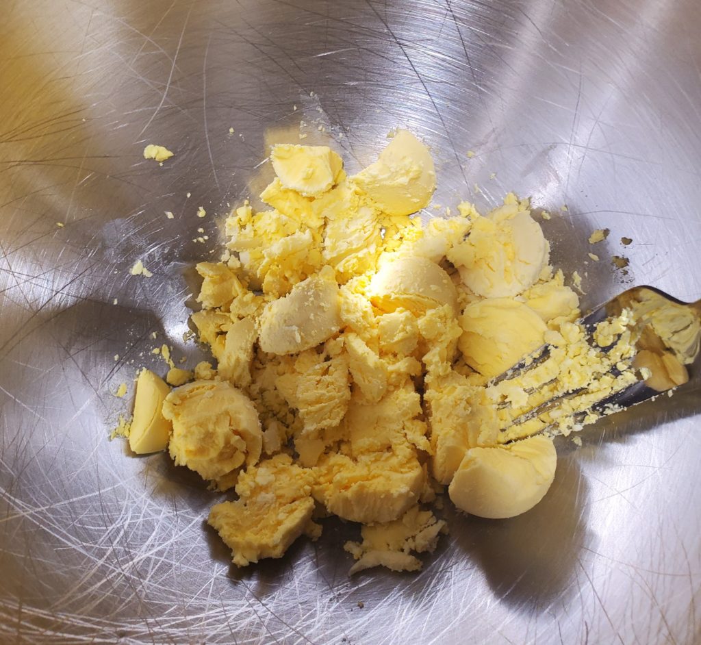 Mashing the yolks with a fork