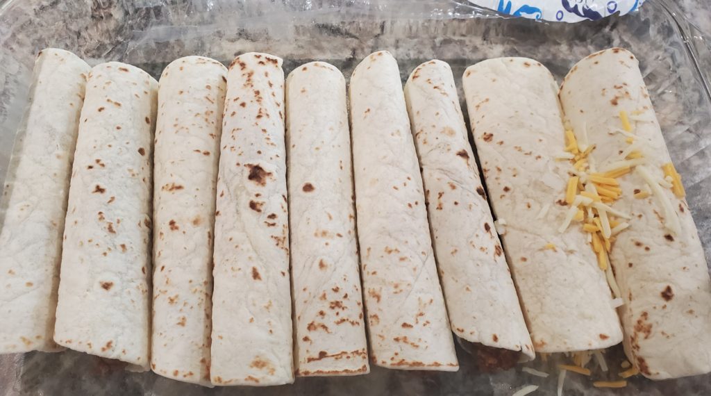 Rolled beef enchiladas in the baking dish