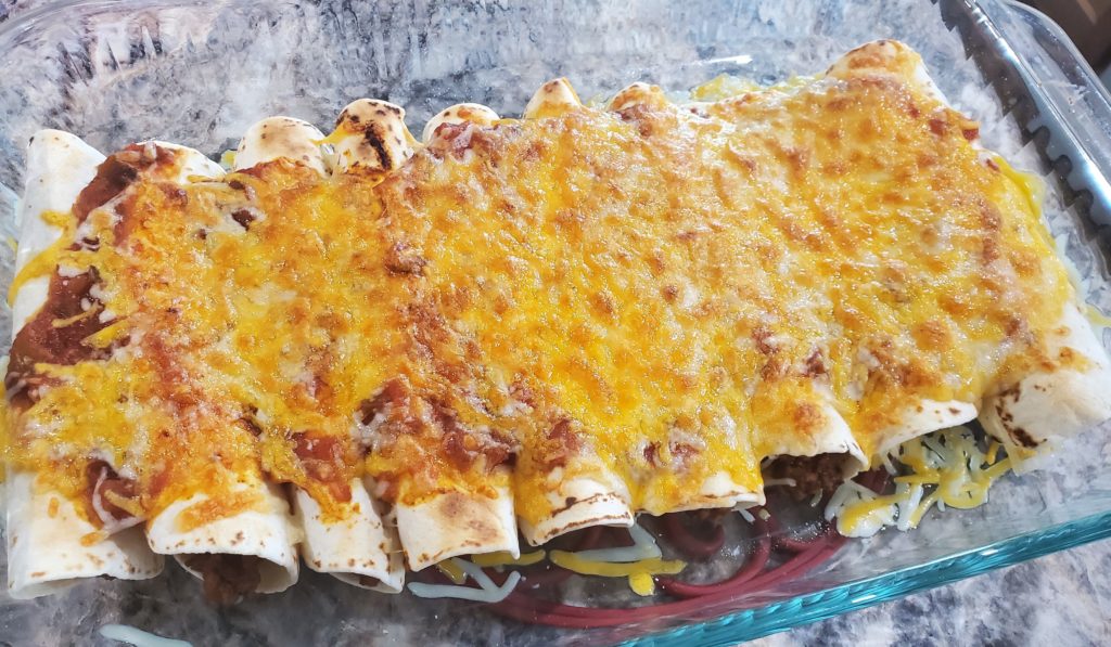 The beef enchiladas fresh from the oven with melted cheese