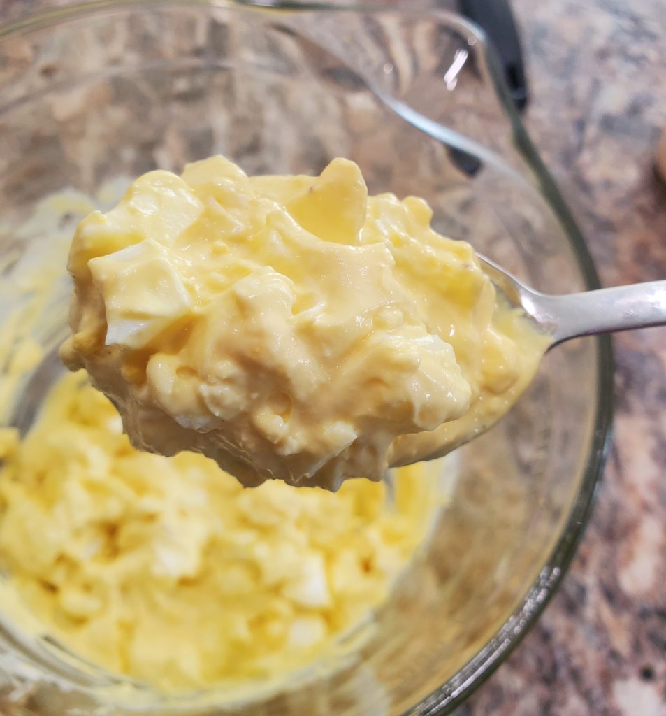 A spoonful of the completed egg salad