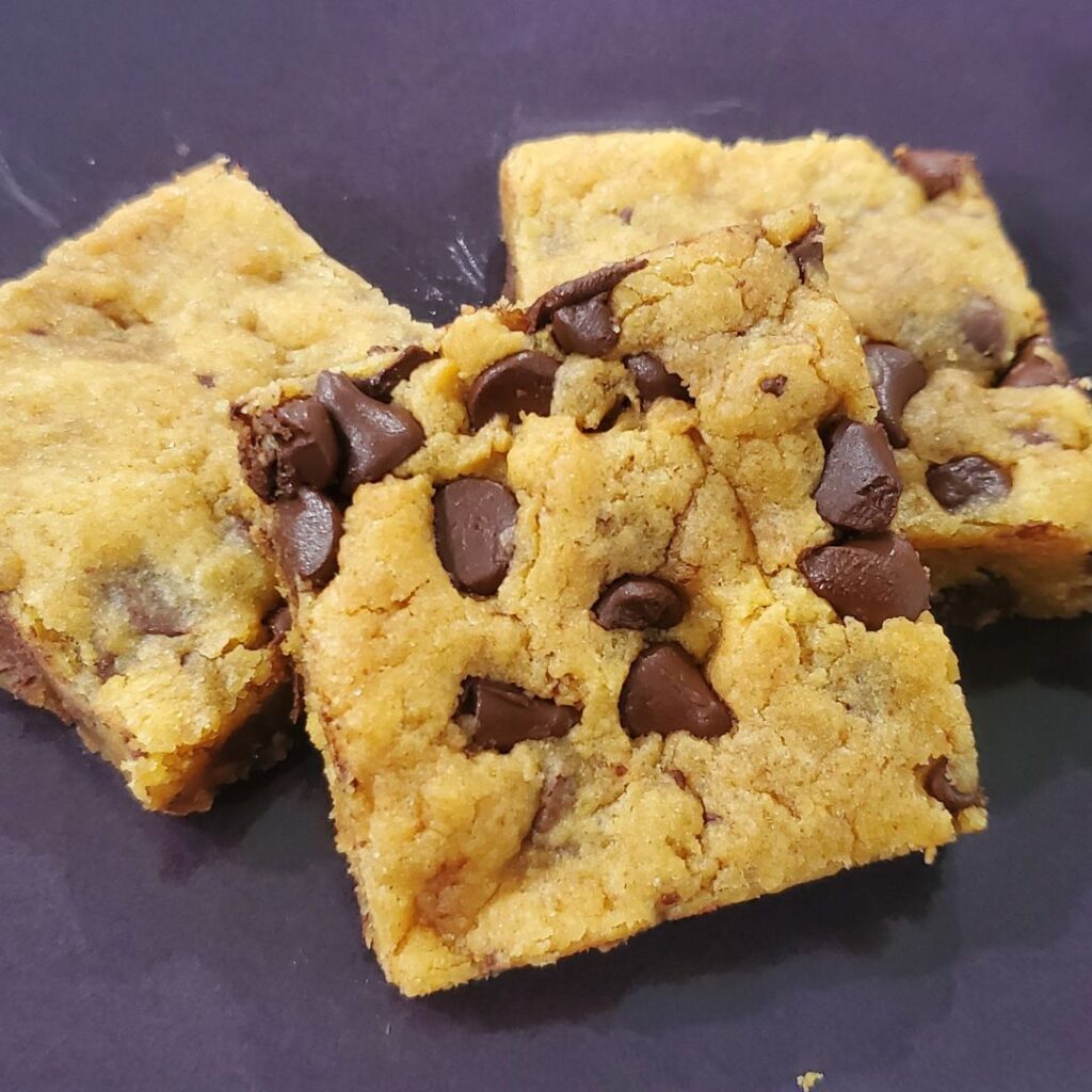 Peanut butter chocolate chip cookie bars on a plate